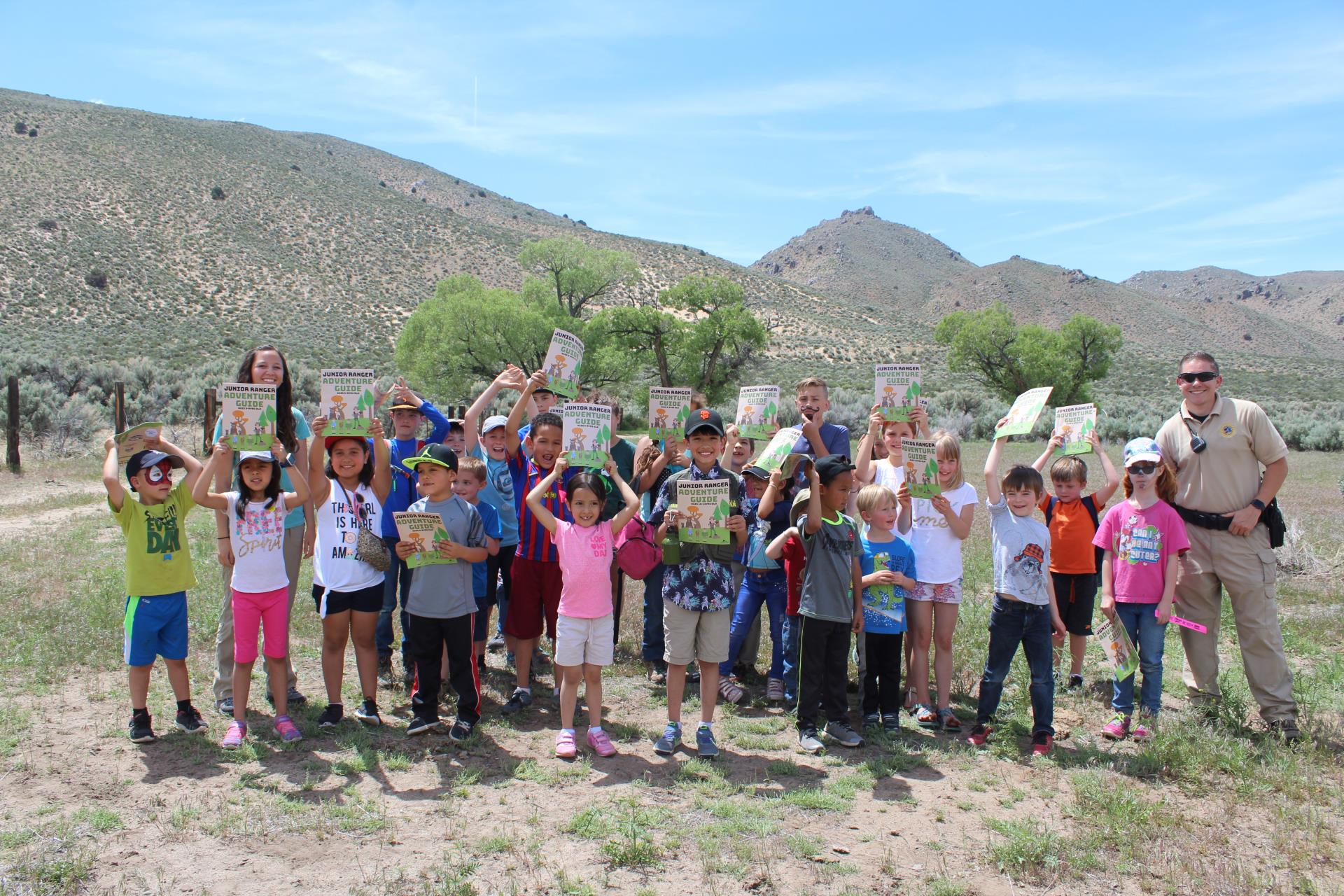 Accomplished JR Rangers proudly hold up their Ranger Packet!